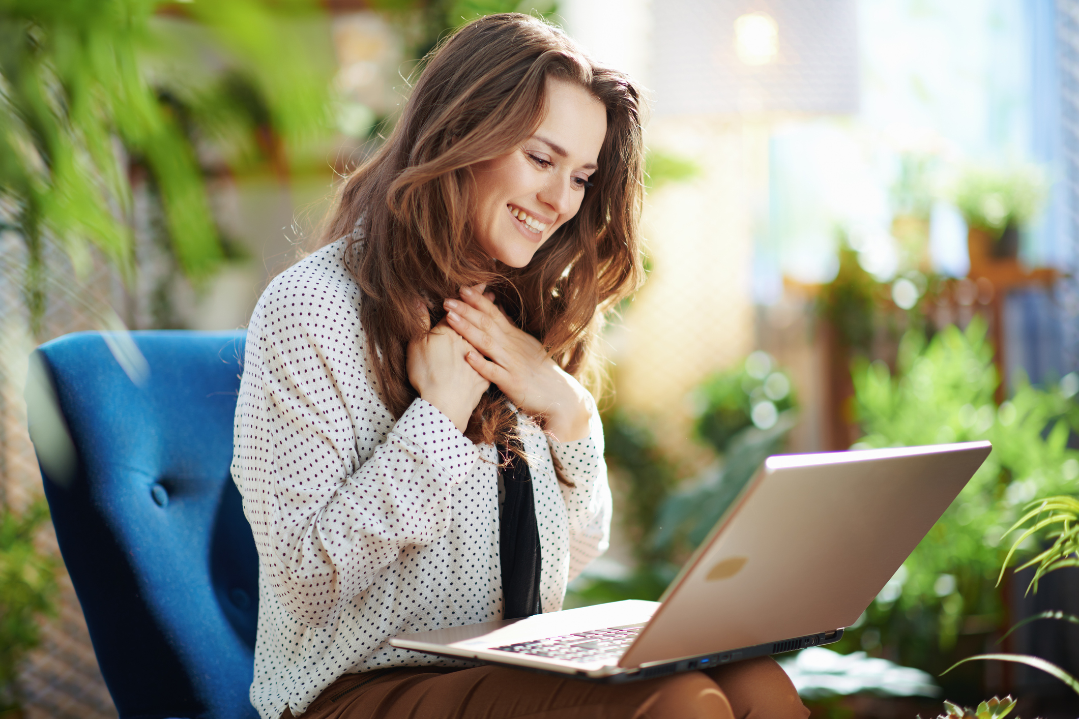 Woman working contentedly from her home office