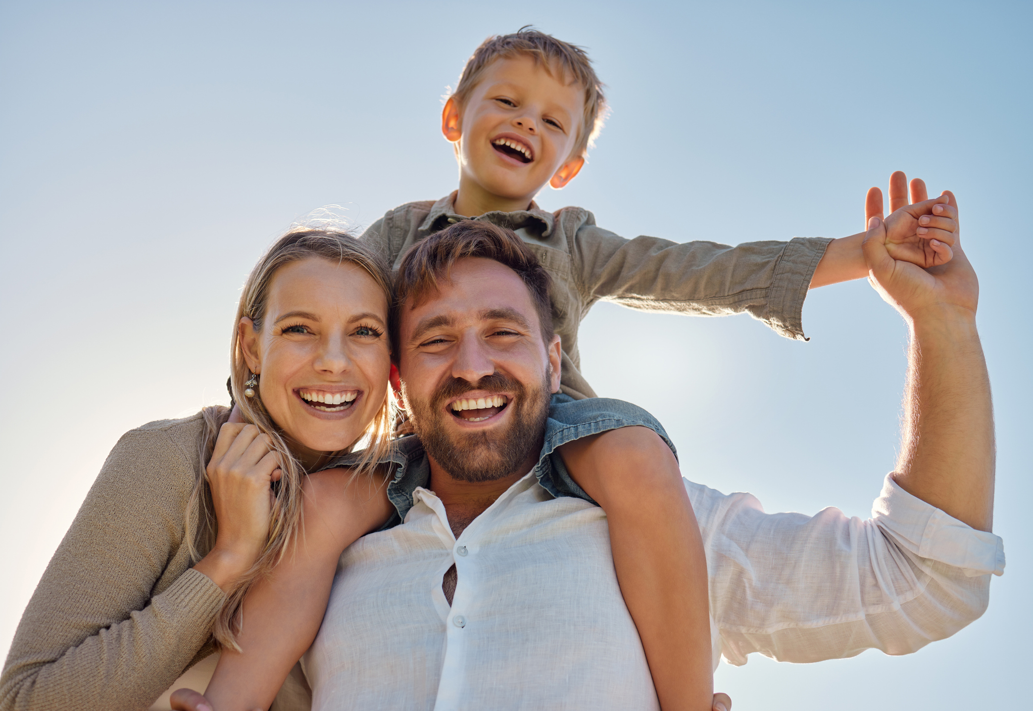 Mother laughing joyfully with her children during the holidays